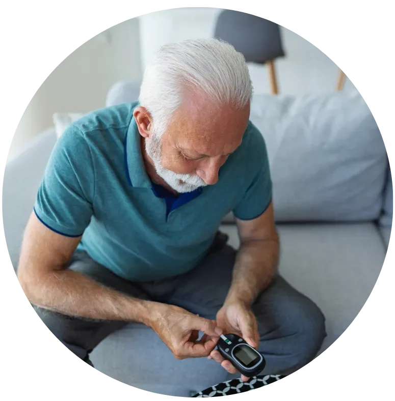 Senior checking blood sugar for diabetes and glucose regulation