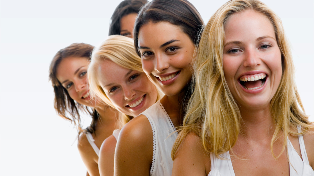 Smiling women outdoors representing skin and wellness support