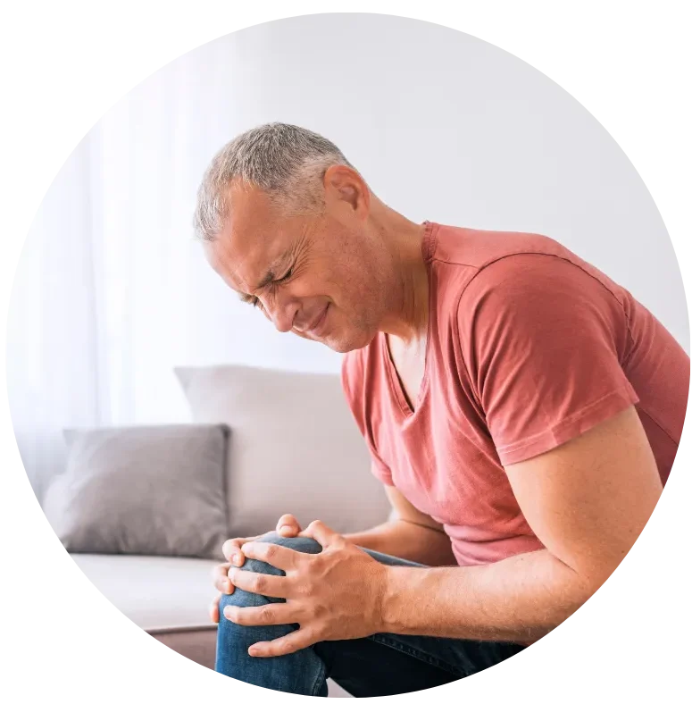 Older adult with knee pain representing regenerative medicine for joint pain and arthritis