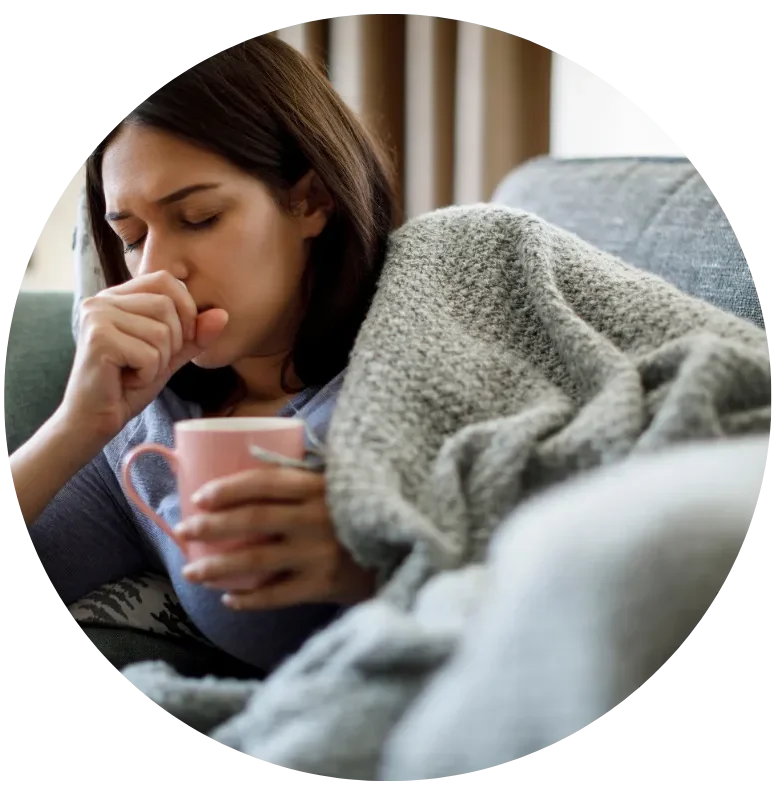 Woman resting with tea while dealing with chronic illness symptoms