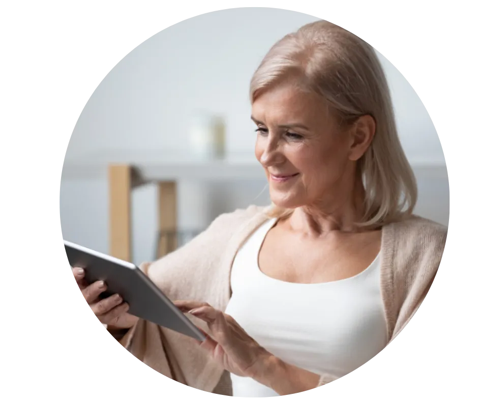 Woman using a tablet representing systemic health support in regenerative medicine