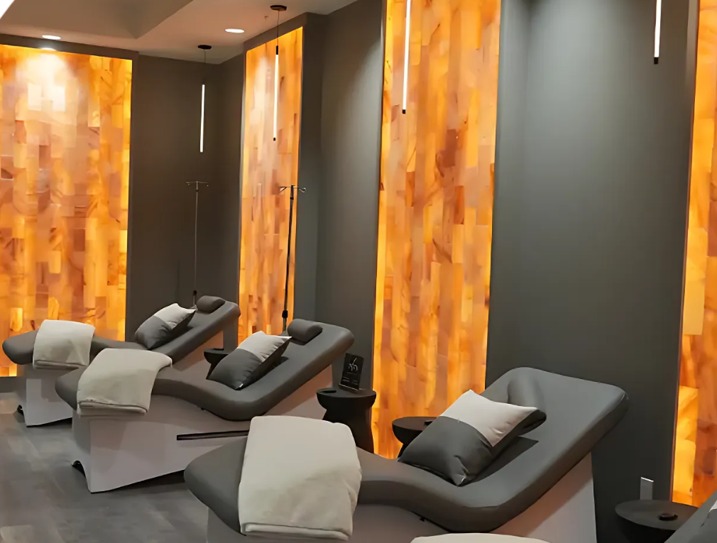 Salt room therapy lounge chairs with glowing salt walls