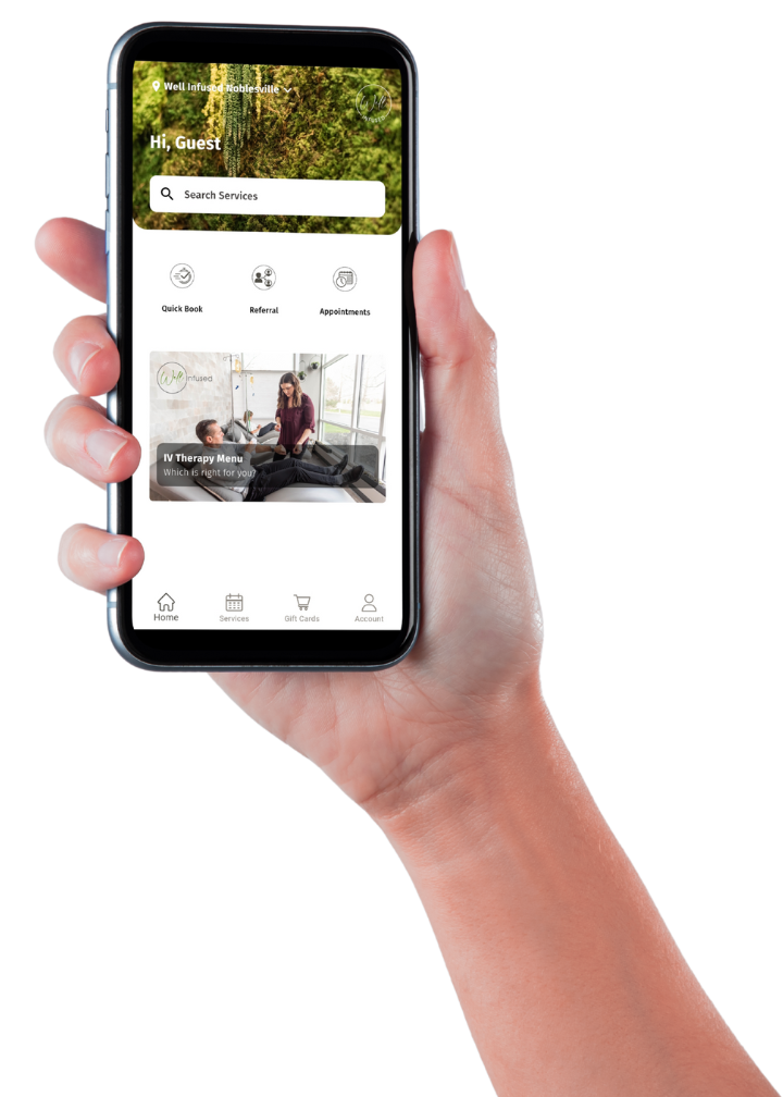 Hand holding Well Infused mobile app for booking services