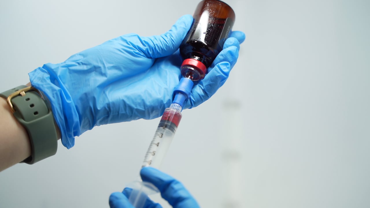 Vitamin shots and vitamin injections preparation with syringe and vial